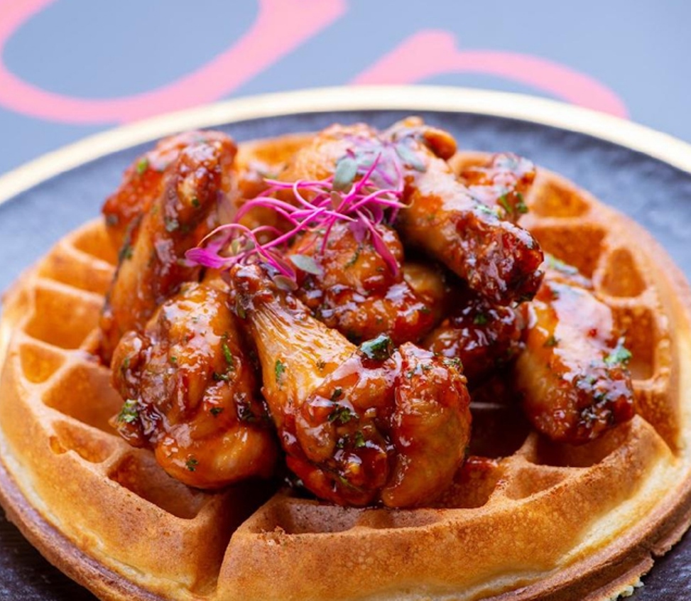 Frango glazed chicken wings served on a golden waffle